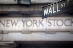A Wall Street sign is pictured outside the New York Stock Exchange in New York,