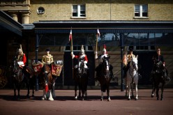 Members of the Household Cavalry ride on horses in the courtyard of the Royal Mews during the media launch of the 'Platinum Jubilee Celebration: A Gallop Through History' at Buckingham Palace in London,