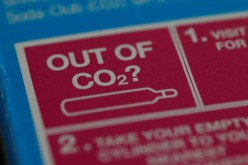 An information label is seen on packaging for a CO2 cylinder for a fizzy drinks machine in Manchester, Britain