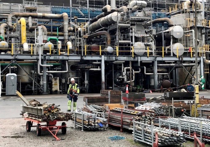 A worker walks at the Yara ammonia plant in Porsgrunn, Norway