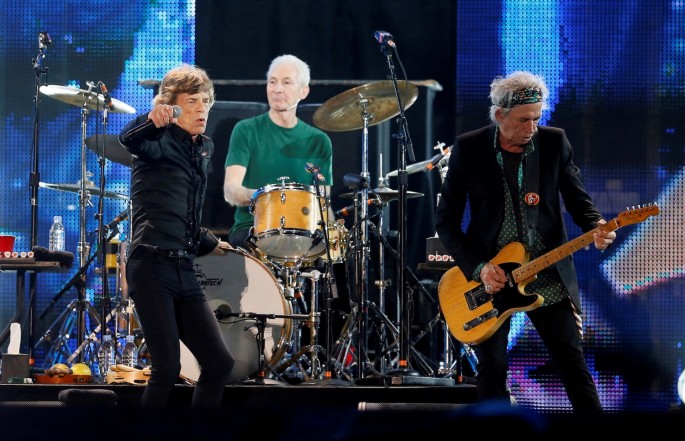 Mick Jagger (L), Charlie Watts (C) and Keith Richards of the Rolling Stones perform during a concert in Abu Dhabi