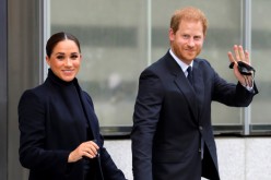 Britain's Prince Harry and Meghan, Duke and Duchess of Sussex, wave as they visit One World Trade Center in Manhattan, New York City, U.S.