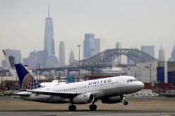 A United Airlines passenger jet takes off with New York City as a backdrop, at Newark Liberty International Airport, New Jersey, U.S.