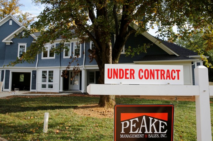 A real estate sign advertising a home "Under Contract" is pictured in Vienna, Virginia, outside of Washington