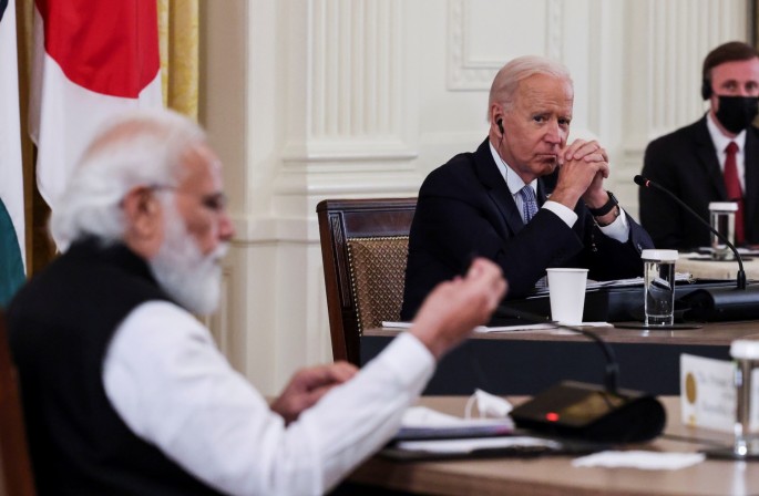U.S. President Joe Biden listens as India's Prime Minister Narendra Modi speaks during a 'Quad nations' meeting at the Leaders' Summit of the Quadrilateral Framework held in the East Room at the White House in Washington, U.S., 