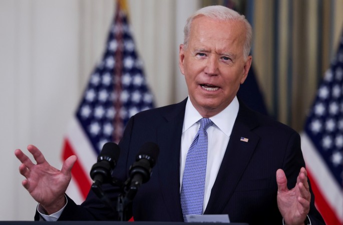 U.S. President Joe Biden responds to a question from a reporter after speaking about coronavirus disease (COVID-19) vaccines and booster shots in the State Dining Room at the White House in Washington, U.S., 