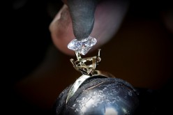 A worker sets an Aether diamond made from captured CO2 into a ring at the RFG Manufacturing Riviera jewelry design facility in Manhattan in New York City, New York, U.S.,