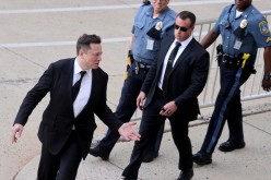 Tesla CEO Elon Musk reacts to onlookers as he departs after taking the stand to defend Tesla Inc's 2016 deal for SolarCity in a case before the Delaware Court of Chancery in Wilmington,