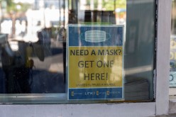 A sign advertises free masks to prevent the spread of the coronavirus disease (COVID-19), at the downtown bus station in Tucson, Arizona, U.S.