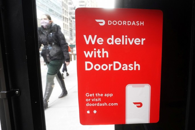A DoorDash sign is pictured on a restaurant on the day they hold their IPO in the Manhattan borough of New York City, New York, U.S.,