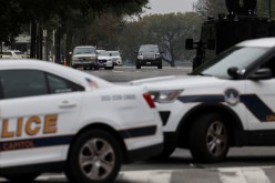 An SUV is seen as U.S. Capitol Police vehicles block a street while investigating reports of a suspicious vehicle in front of the U.S. Supreme Court in Washington, U.S.