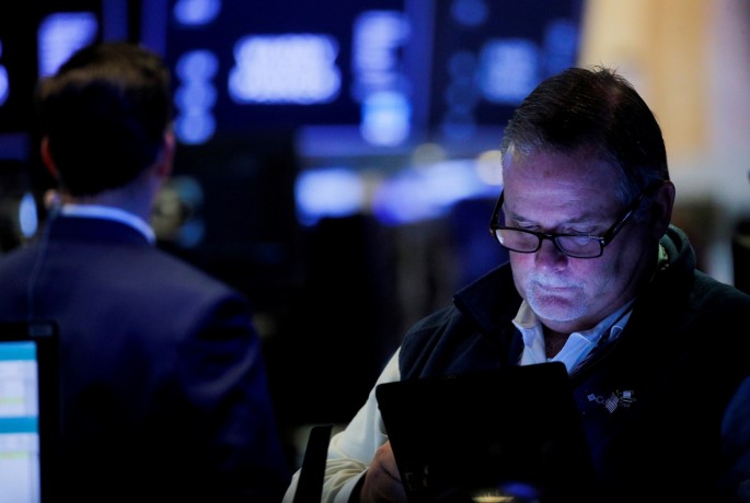 Traders work on the floor of the New York Stock Exchange (NYSE) in New York City, U.S.,