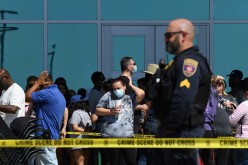 Family members wait in line to be reunited with their loved ones at the Mansfield Center for the Performing Arts after a shooting at Mansfield Timberview High School in Arlington, Texas, U.S.