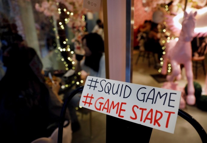 A sign referring to the "honeycomb challenge" featured in Netflix's new hit series "Squid Game" is seen at Brown Butter Cafe in Singapore