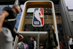 The NBA logo is displayed as people pass by the NBA Store in New York City, U.S.