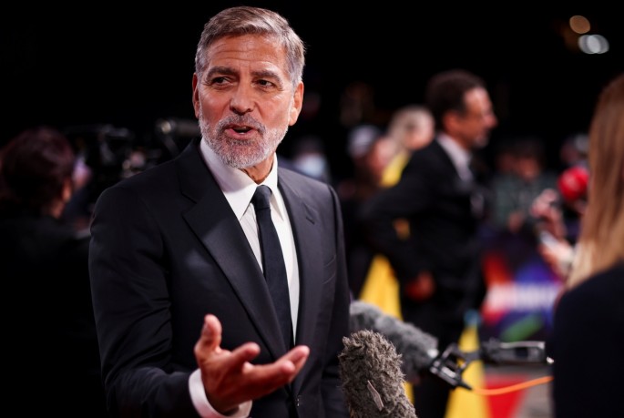 Director George Clooney speaks to the media as he arrives for a screening of the film "The Tender Bar" as part of the BFI London Film Festival, in London, Britain