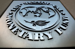 The International Monetary Fund (IMF) logo is seen outside the headquarters building in Washington, U.S.