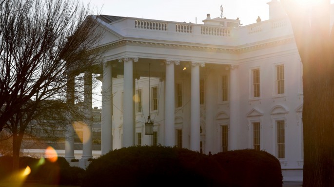 A general view of the sun rising behind the White House in Washington, U.S. 