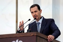 Syria's President Bashar al-Assad addresses the new members of parliament in Damascus, Syria in this handout released by SANA