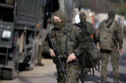 Polish Army soldiers are seen in front of the Border Guard headquarters in Michalowo, Poland 