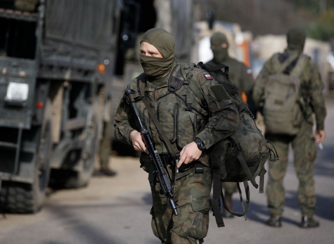 Polish Army soldiers are seen in front of the Border Guard headquarters in Michalowo, Poland 