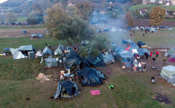 An aerial picture shows Afghan migrants in a makeshift camp near Velika Kladusa, Bosnia, 