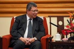 Malaysian Foreign Minister Dato' Saifuddin Abdullah speaks with member of the Politburo of the Communist Party of China Yang Jiechi (not pictured) during a meeting in Beijing, 