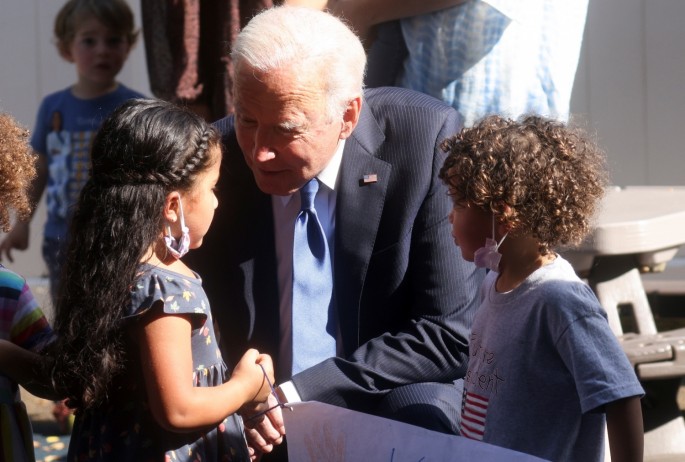 U.S. President Joe Biden is welcomed by children at the Capitol Child Development Center in Hartford, Connecticut, U.S.,