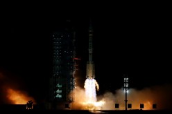 The Long March-2F Y13 rocket, carrying the Shenzhou-13 spacecraft and three astronauts in China's second crewed mission to build its own space station, launches at Jiuquan Satellite Launch Center near Jiuquan, Gansu province,