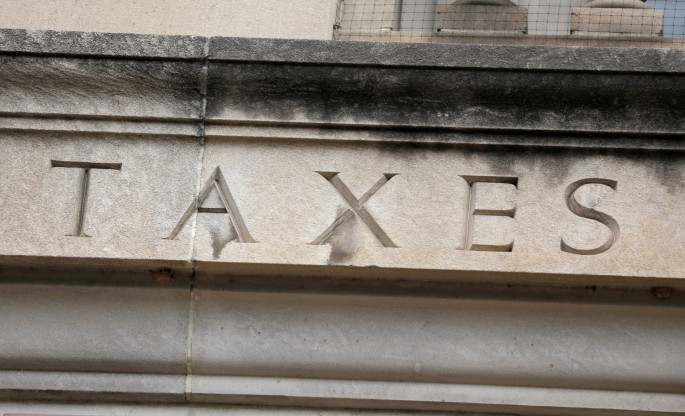The word "taxes" is seen engraved at the headquarters of the Internal Revenue Service (IRS) in Washington, D.C., U.S.,