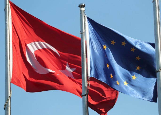 European Union (R) and Turkish flags fly at the business and financial district of Levent in Istanbul, Turkey