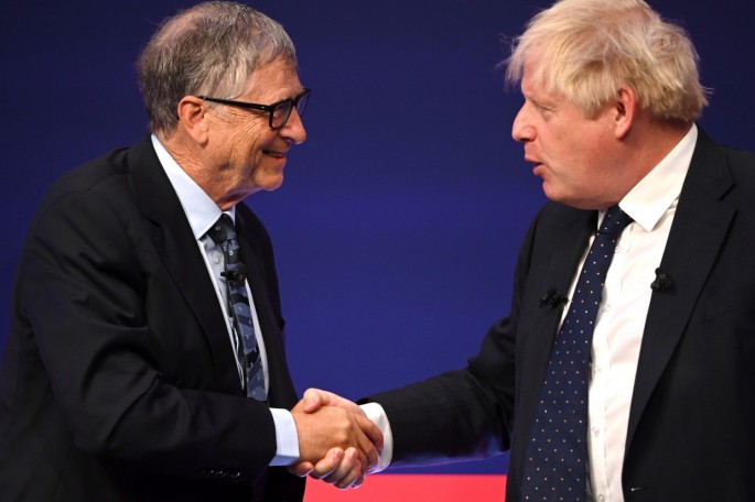 Britain's Prime Minister Boris Johnson and Bill Gates shake hands during the Global Investment Summit at the Science Museum, in London, Britain,