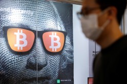 An advertisement for Bitcoin and cryptocurrencies is seen in Hong Kong, China