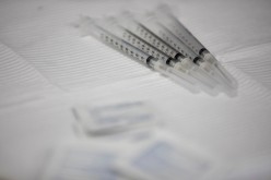 Syringes filled with the Pfizer-BioNTech vaccine sit on table during vaccine clinic in Southfield, Michigan, U.S.,