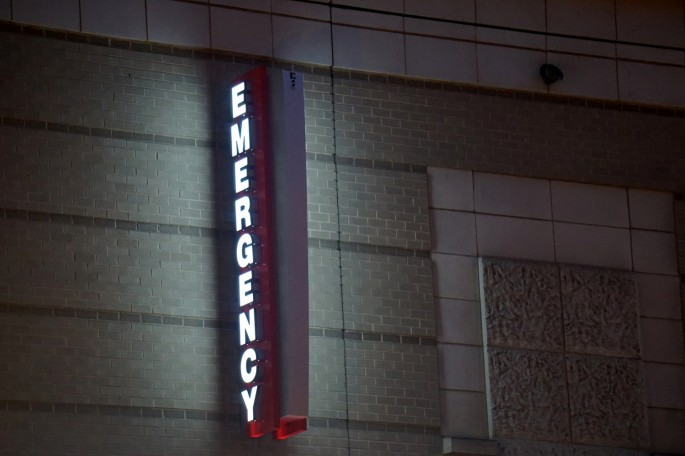 An emergency sign illuminates outside of George Washington University Hospital, one of roughly 400 Universal Health Services, Inc (UHS) facilities across the United States and the U.K.