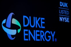 The company logo and ticker for Duke Energy Corp. is displayed on a screen on the floor of the New York Stock Exchange (NYSE) in New York, U.S.