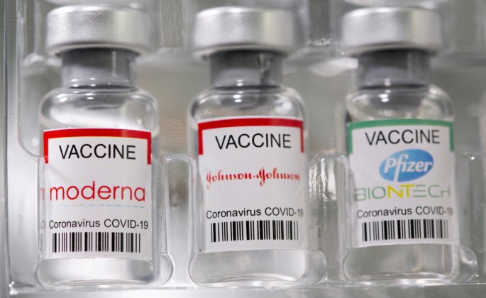 Vials labelled "Moderna, Johnson & Johnson, Pfizer-BioNTech coronavirus disease (COVID-19) vaccine" are seen in this illustration picture taken