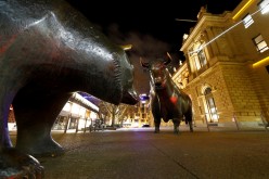 Bull and bear symbols for successful and bad trading are seen in front of the German stock exchange (Deutsche Boerse) in Frankfurt, Germany