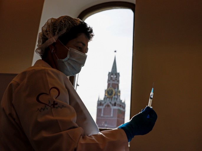 A medical specialist prepares a dose of a vaccine against the coronavirus disease (COVID-19) at a vaccination centre in the State Department Store, GUM, in Moscow, Russia