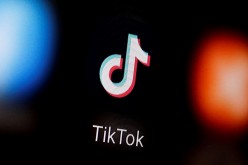 A TikTok logo is displayed on a smartphone in this illustration taken 