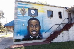 A mural of Ahmaud Arbery is painted on the side of The Brunswick African American Cultural Center in downtown Brunswick, Georgia, U.S