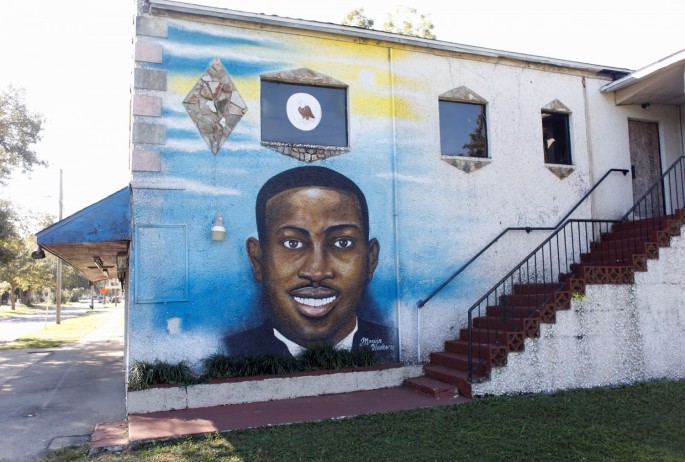 A mural of Ahmaud Arbery is painted on the side of The Brunswick African American Cultural Center in downtown Brunswick, Georgia, U.S