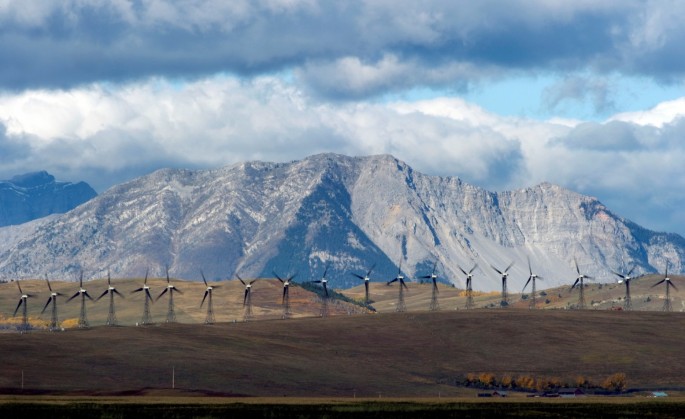 Windmills generate electricity in the windy rolling foothills of the Rocky Mountains near the town of Pincher Creek, Alberta