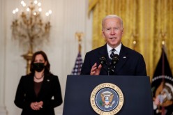 U.S. President Joe Biden delivers remarks about his Build Back Better agenda and the bipartisan infrastructure deal as Vice President Kamala Harris stands by in the East Room of the White House in Washington, U.S.
