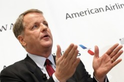 U.S. Airways CEO Doug Parker announces the planned merger of AMR Corp, the parent of American Airlines, with U.S. Airways during a news conference at Dallas-Ft Worth International Airport