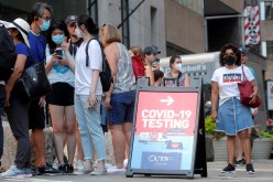People line up at a coronavirus disease (COVID-19) testing at a mobile testing van in New York City, U.S., 