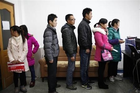 Jobseekers in China queue up for an interview. 