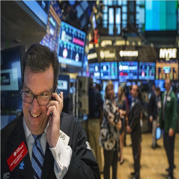A trader works on the floor of the New York Stock Exchange shortly before the end of the day's trading.