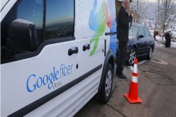 A technician gets cabling out of his truck to install Google Fiber in a residential home in Provo, Utah.