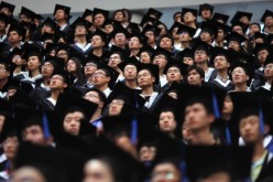 Students attend a graduation ceremony in Shanghai’s Fudan University. 